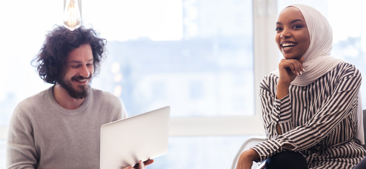 Young successful people brainstorming at a creative meeting.