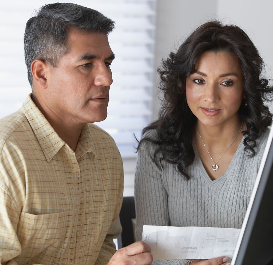 Couple working on finances on laptop