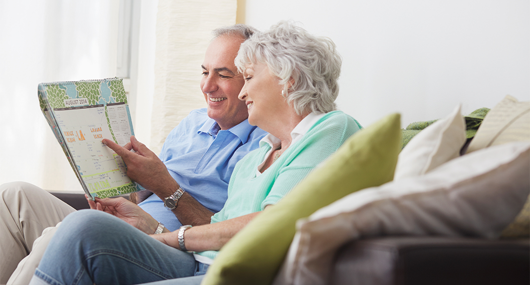 Retired couple learning about Medicare enrollment options